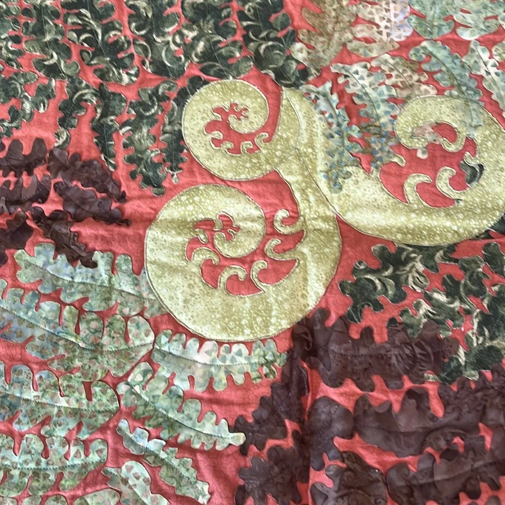 Beautiful terra cotta and green quilt wall hanging. Homemade.